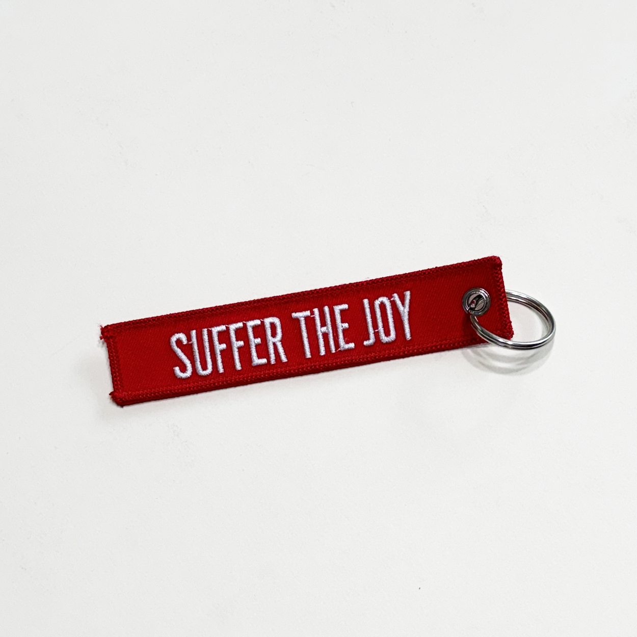 Suffer The Joy Keychain